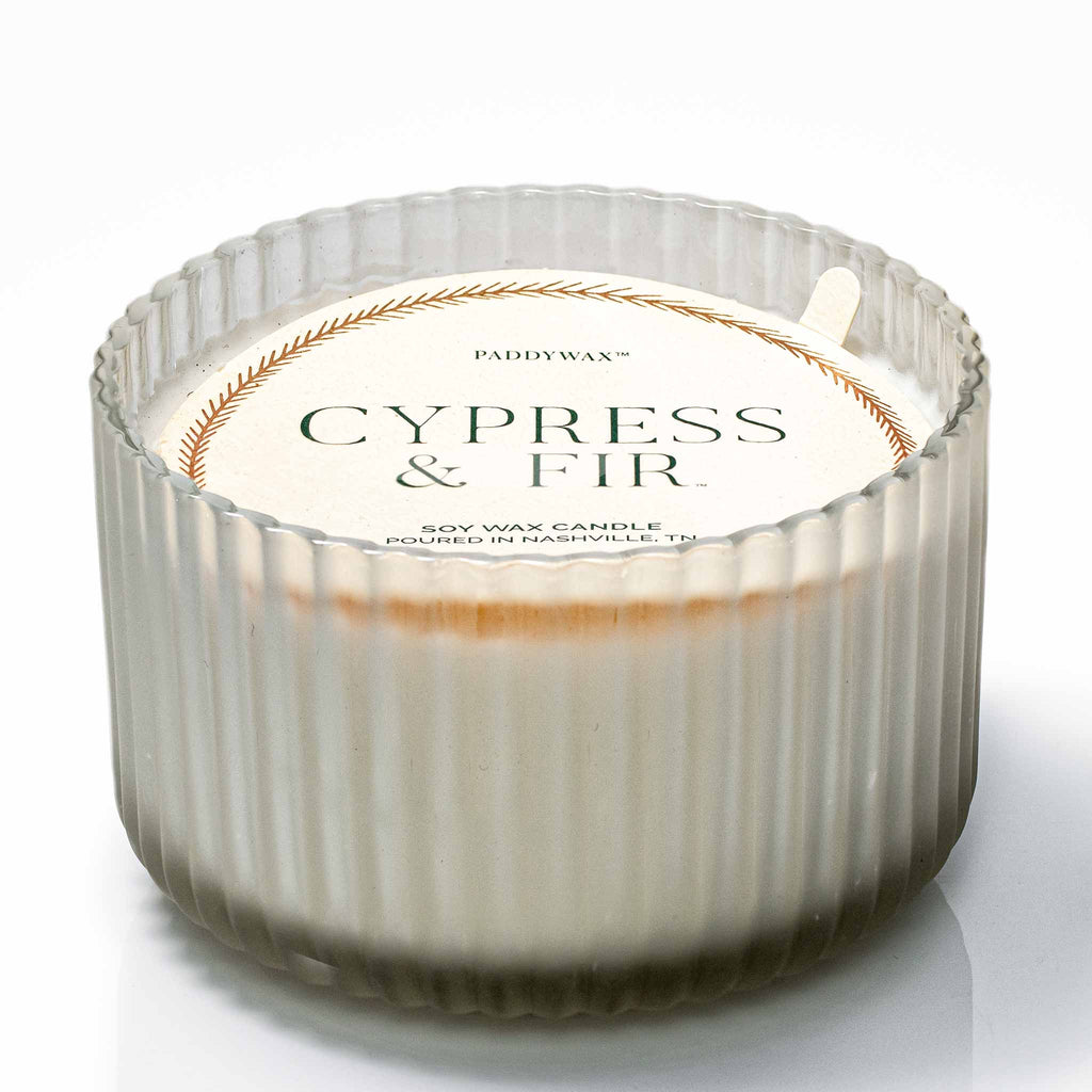 https://www.thekingsofstyling.com/cdn/shop/files/Paddywax--Holiday-Large-White-Ribbed-Glass-Soywax-Candle-For-The-Kings-of-Styling_1024x1024.jpg?v=1699374928